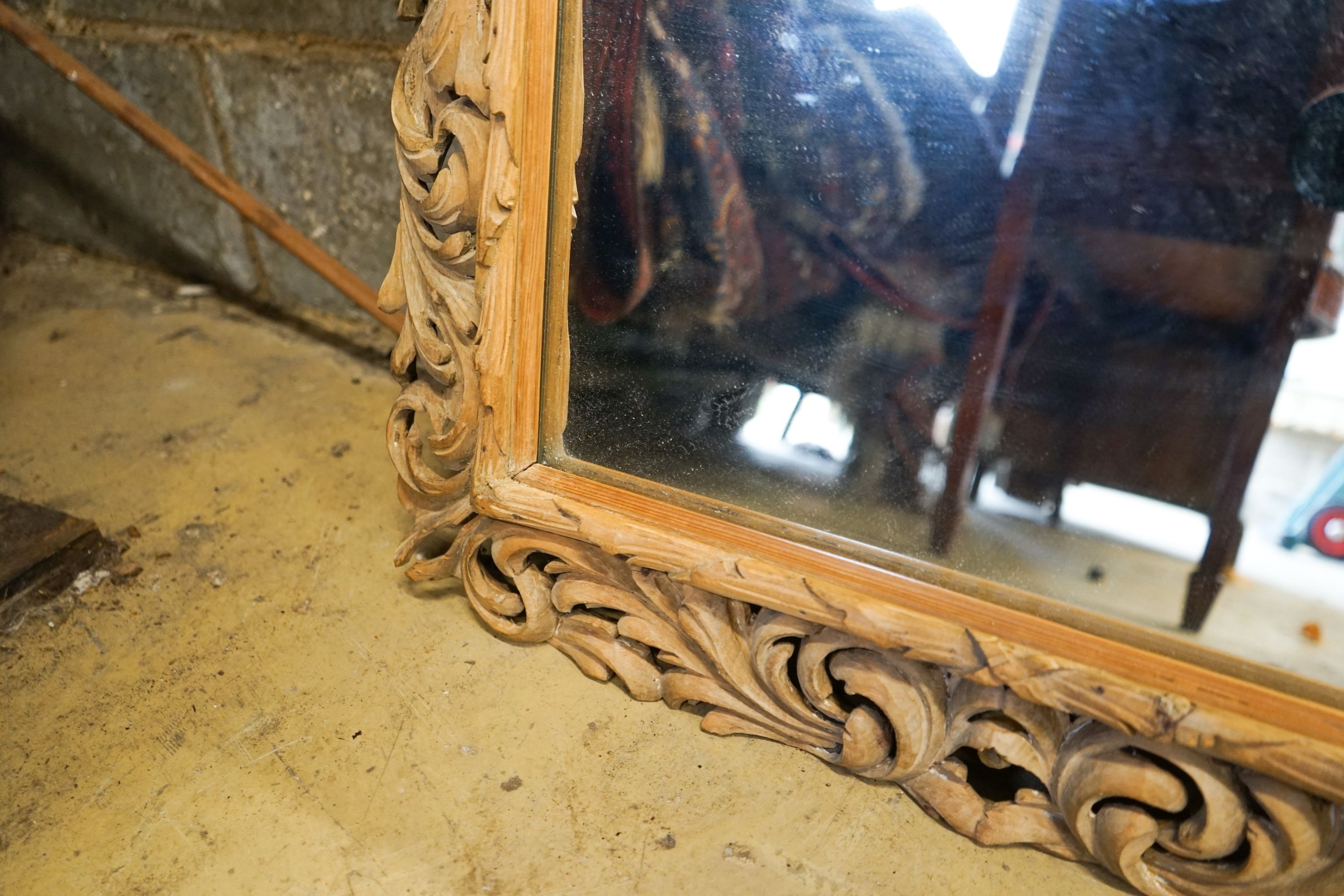 A carved oak framed rectangular wall mirror, width 65cm, height 82cm